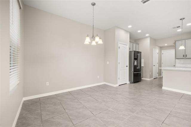 1915 Terrapin Rd, Ocoee, FL 34761 - kitchen with stainless steel fridge with ice dispenser, a chandelier, light countertops, recessed lighting, and baseboards
