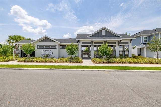 1915 Terrapin Rd, Ocoee, FL 34761 - view of front facade with a fenced front yard, a gate, and board and batten siding