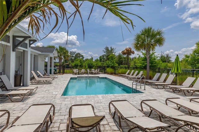 1915 Terrapin Rd, Ocoee, FL 34761 - community pool featuring a patio area and fence