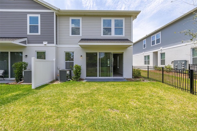 1915 Terrapin Rd, Ocoee, FL 34761 - rear view of property with central AC unit, a shingled roof, and stucco siding