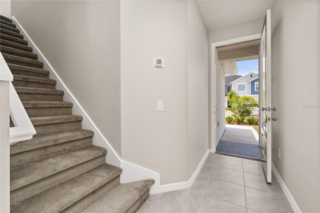 1915 Terrapin Rd, Ocoee, FL 34761 - foyer entrance featuring stairs, light tile patterned flooring, and baseboards