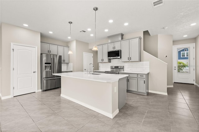 1915 Terrapin Rd, Ocoee, FL 34761 - kitchen featuring stainless steel appliances, gray cabinetry, a sink, light tile patterned floors, and recessed lighting