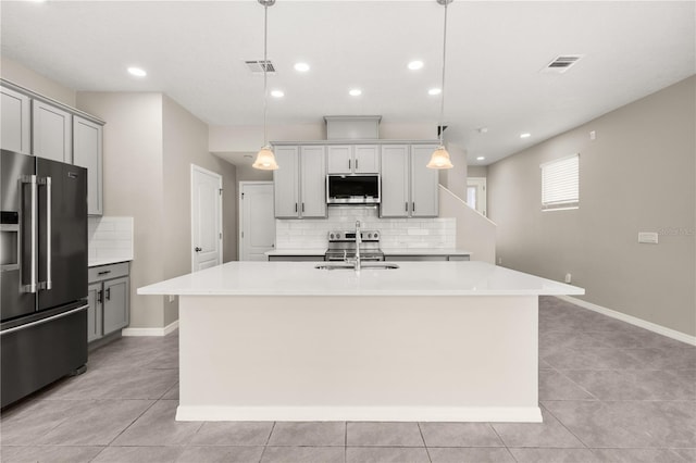1915 Terrapin Rd, Ocoee, FL 34761 - kitchen featuring stainless steel appliances, decorative backsplash, a sink, light countertops, and recessed lighting