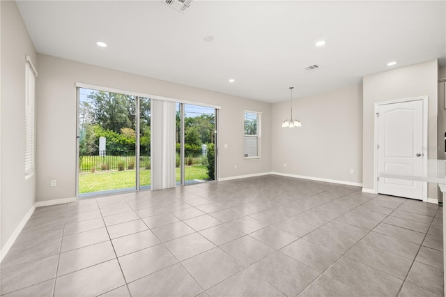 1915 Terrapin Rd, Ocoee, FL 34761 - empty room featuring healthy amount of natural light, a chandelier, light tile patterned flooring, baseboards, and recessed lighting