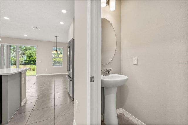 1915 Terrapin Rd, Ocoee, FL 34761 - bathroom with tile patterned floors, recessed lighting, baseboards, and a sink