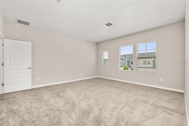 1915 Terrapin Rd, Ocoee, FL 34761 - spare room featuring carpet floors, baseboards, and a textured ceiling