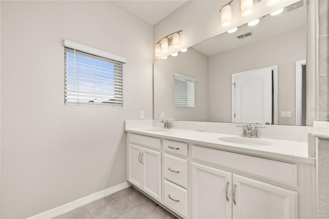 1915 Terrapin Rd, Ocoee, FL 34761 - full bath featuring tile patterned flooring, double vanity, and baseboards