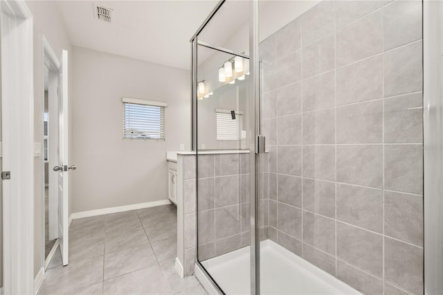 1915 Terrapin Rd, Ocoee, FL 34761 - full bath featuring a shower stall, vanity, tile patterned floors, and baseboards