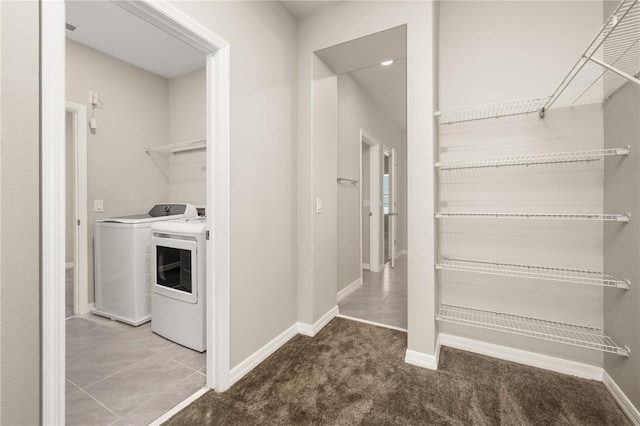 1915 Terrapin Rd, Ocoee, FL 34761 - laundry room featuring independent washer and dryer, baseboards, carpet flooring, and tile patterned floors