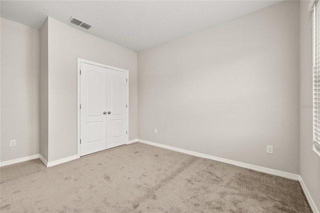 1915 Terrapin Rd, Ocoee, FL 34761 - unfurnished bedroom with carpet flooring, baseboards, and a closet