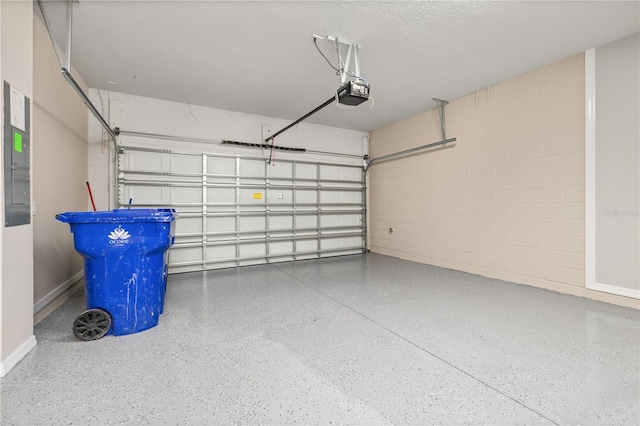 1915 Terrapin Rd, Ocoee, FL 34761 - garage with concrete block wall, a garage door opener, and baseboards
