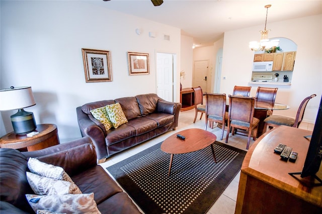 2788 Almaton Loop Unit 202, Kissimmee, FL 34747 - living room featuring light tile patterned floors, a chandelier, and ceiling fan