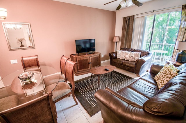 2788 Almaton Loop Unit 202, Kissimmee, FL 34747 - living room featuring a ceiling fan, light tile patterned flooring, and baseboards