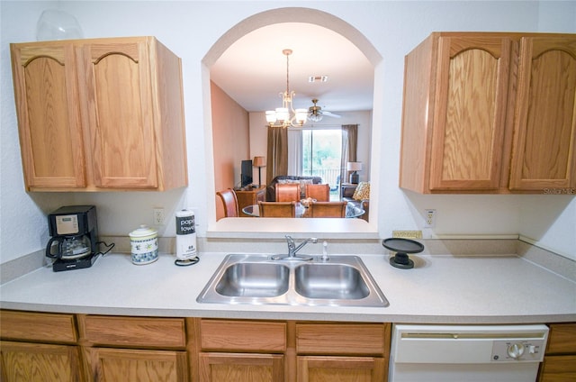 2788 Almaton Loop Unit 202, Kissimmee, FL 34747 - kitchen with white dishwasher, a sink, arched walkways, and light countertops