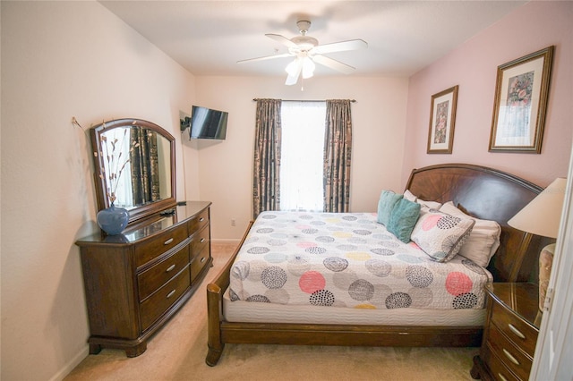 2788 Almaton Loop Unit 202, Kissimmee, FL 34747 - bedroom featuring light carpet, baseboards, and a ceiling fan