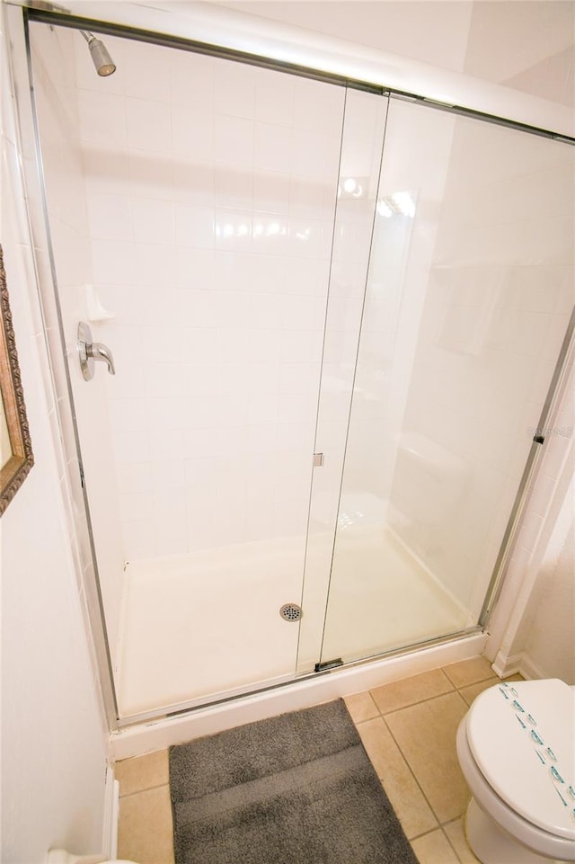 2788 Almaton Loop Unit 202, Kissimmee, FL 34747 - full bath with tile patterned floors, a stall shower, and toilet