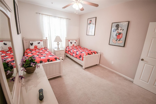 2788 Almaton Loop Unit 202, Kissimmee, FL 34747 - bedroom with light carpet, ceiling fan, and baseboards