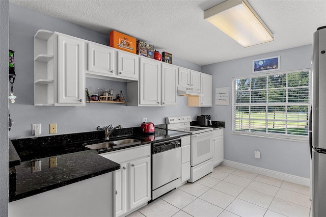 425 Eagle Ridge Dr Unit 425, Davenport, FL 33837 - kitchen with appliances with stainless steel finishes, open shelves, a sink, under cabinet range hood, and white cabinets