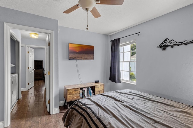 425 Eagle Ridge Dr Unit 425, Davenport, FL 33837 - bedroom featuring washer and dryer, wood finished floors, baseboards, a textured ceiling, and a ceiling fan