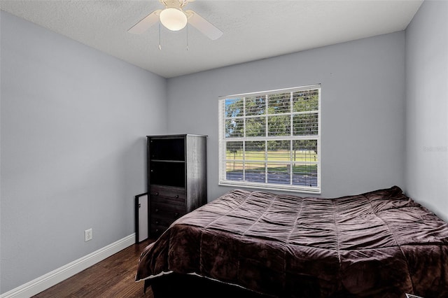 425 Eagle Ridge Dr Unit 425, Davenport, FL 33837 - bedroom with wood finished floors, baseboards, and ceiling fan