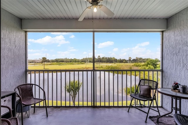 425 Eagle Ridge Dr Unit 425, Davenport, FL 33837 - sunroom / solarium featuring a ceiling fan and a water view