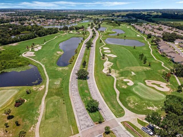 425 Eagle Ridge Dr Unit 425, Davenport, FL 33837 - aerial view of property and surrounding area with a large body of water, nearby suburban area, and a golf course