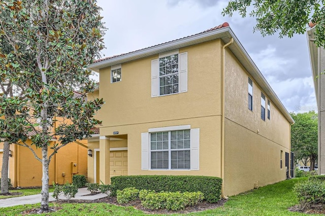 view of property exterior with stucco siding