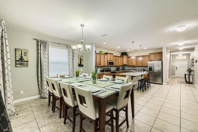 dining space with light tile patterned floors, a chandelier, baseboards, and recessed lighting