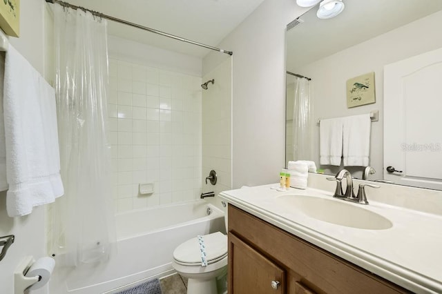 bathroom featuring toilet, shower / bath combo, and vanity