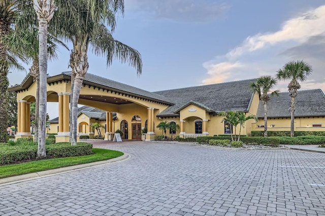 view of property featuring curved driveway