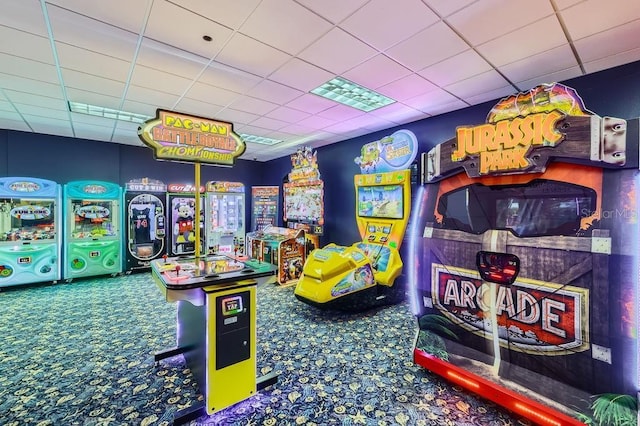 rec room with carpet and a drop ceiling