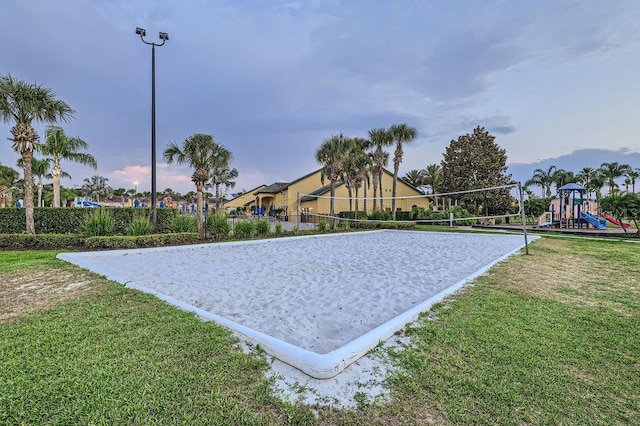 view of home's community featuring a lawn and volleyball court