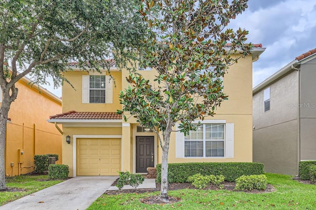multi unit property with an attached garage, stucco siding, driveway, and a tiled roof