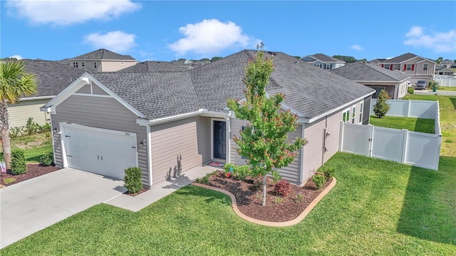 view of front of home with a garage, a shingled roof, concrete driveway, and a residential view