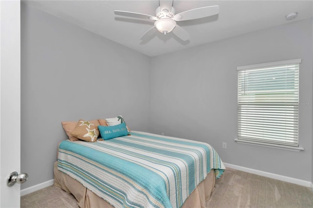 bedroom with carpet, baseboards, and ceiling fan