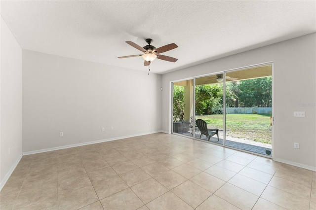 2827 Park Meadow Dr, Apopka, FL 32703 - unfurnished room featuring a ceiling fan, light tile patterned flooring, and a textured ceiling
