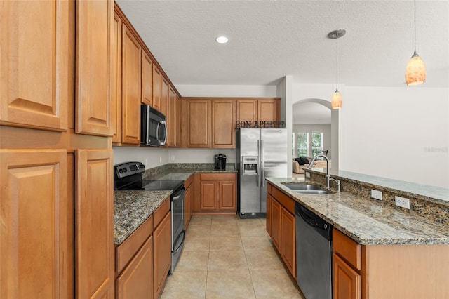 2827 Park Meadow Dr, Apopka, FL 32703 - kitchen featuring appliances with stainless steel finishes, arched walkways, stone counters, decorative light fixtures, and light tile patterned floors