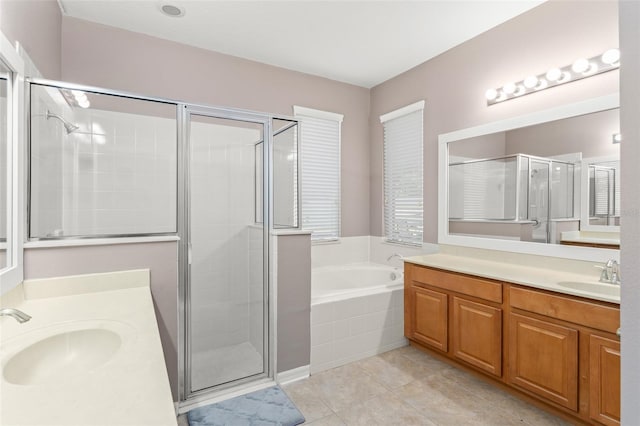 2827 Park Meadow Dr, Apopka, FL 32703 - bathroom featuring two vanities, a shower stall, and a bath