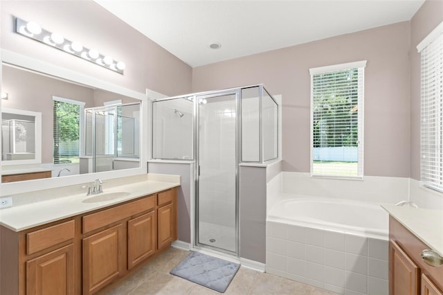 2827 Park Meadow Dr, Apopka, FL 32703 - full bathroom with vanity, a garden tub, a stall shower, and tile patterned flooring