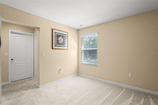 2827 Park Meadow Dr, Apopka, FL 32703 - empty room featuring light colored carpet and a textured ceiling