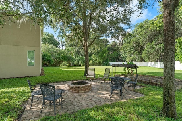 2827 Park Meadow Dr, Apopka, FL 32703 - view of patio / terrace featuring a fire pit and view of wooded area