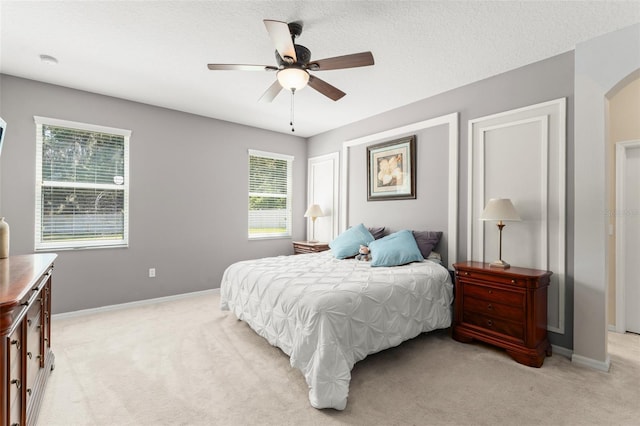 2827 Park Meadow Dr, Apopka, FL 32703 - bedroom featuring light carpet, arched walkways, and ceiling fan