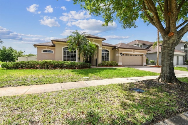 14003 Sobrado Dr, Orlando, FL 32837 - mediterranean / spanish-style home with stucco siding, an attached garage, a front yard, and driveway