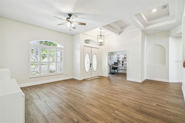 14003 Sobrado Dr, Orlando, FL 32837 - foyer entrance with a ceiling fan, wood finished floors, baseboards, a chandelier, and beam ceiling