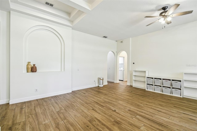 14003 Sobrado Dr, Orlando, FL 32837 - unfurnished living room featuring arched walkways, ceiling fan, wood finished floors, and baseboards