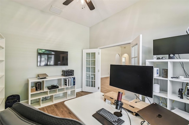 14003 Sobrado Dr, Orlando, FL 32837 - office space with wood finished floors, ceiling fan, a towering ceiling, and baseboards