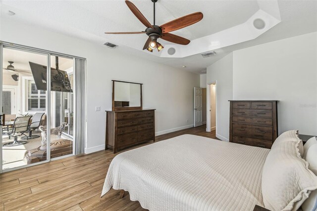 14003 Sobrado Dr, Orlando, FL 32837 - bedroom with access to outside, wood finished floors, a raised ceiling, baseboards, and a ceiling fan