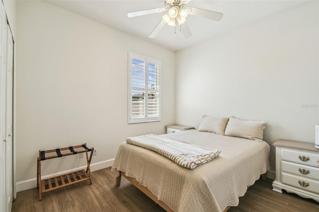 14003 Sobrado Dr, Orlando, FL 32837 - bedroom with wood finished floors, baseboards, and a ceiling fan