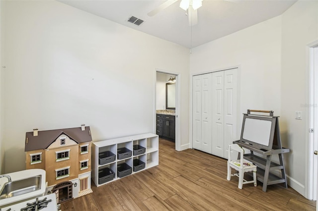 14003 Sobrado Dr, Orlando, FL 32837 - game room with wood finished floors, a ceiling fan, and baseboards