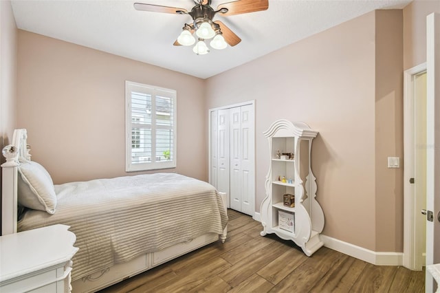 14003 Sobrado Dr, Orlando, FL 32837 - bedroom featuring wood finished floors, baseboards, a closet, and ceiling fan